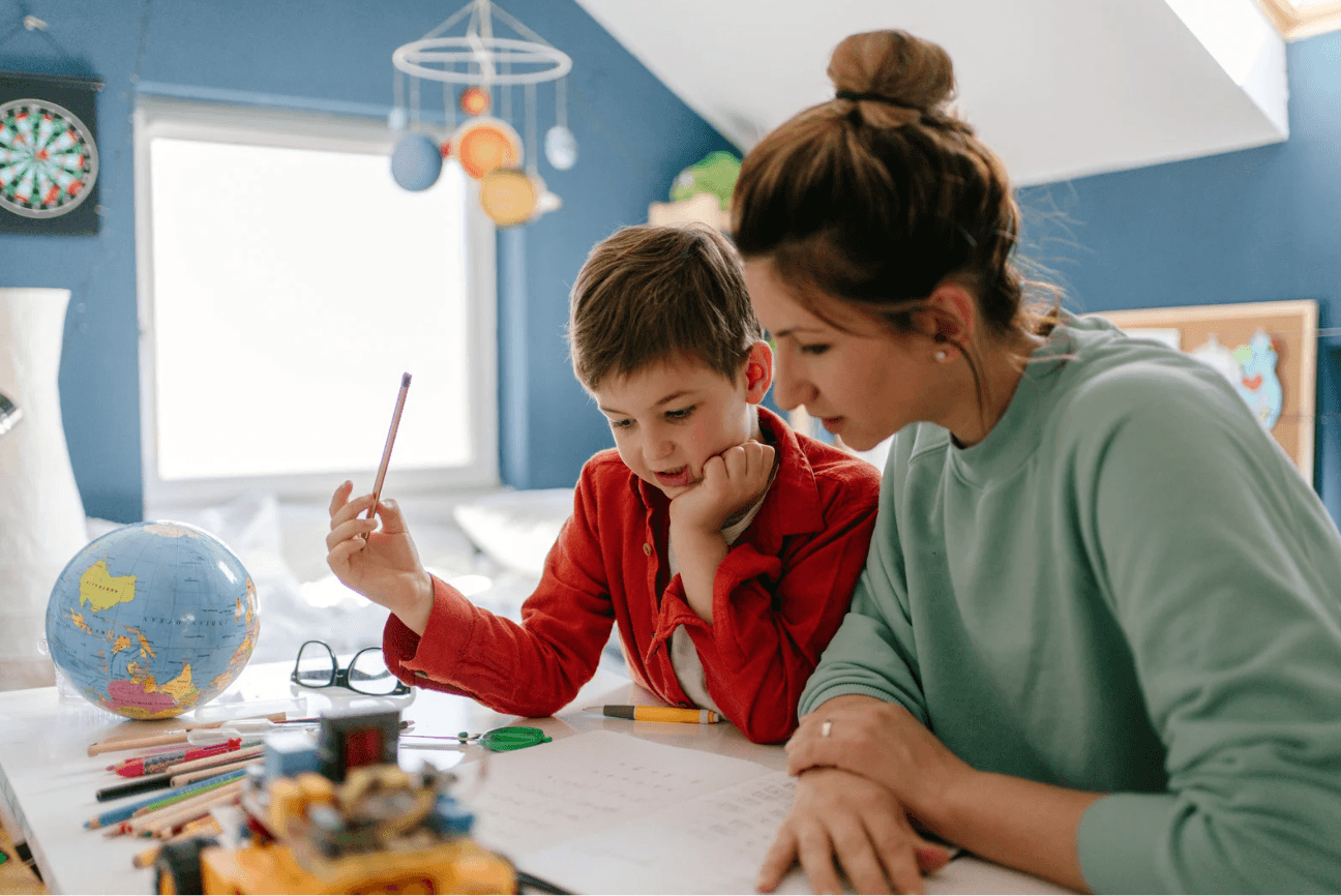 Homeschool parent and child learning together